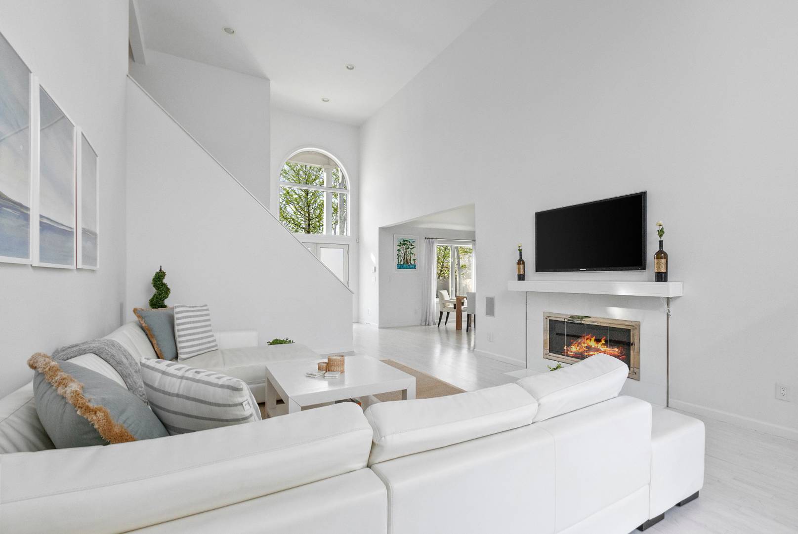 47 Tansey Lane Bridgehampton, NY 11932 - Photo 6 of 28 a living room with furniture and a flat screen tv