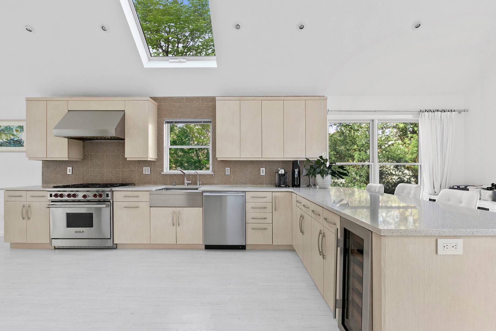 47 Tansey Lane Bridgehampton, NY 11932 - Photo 8 of 28 a kitchen with stainless steel appliances granite countertop a stove a sink and a microwave