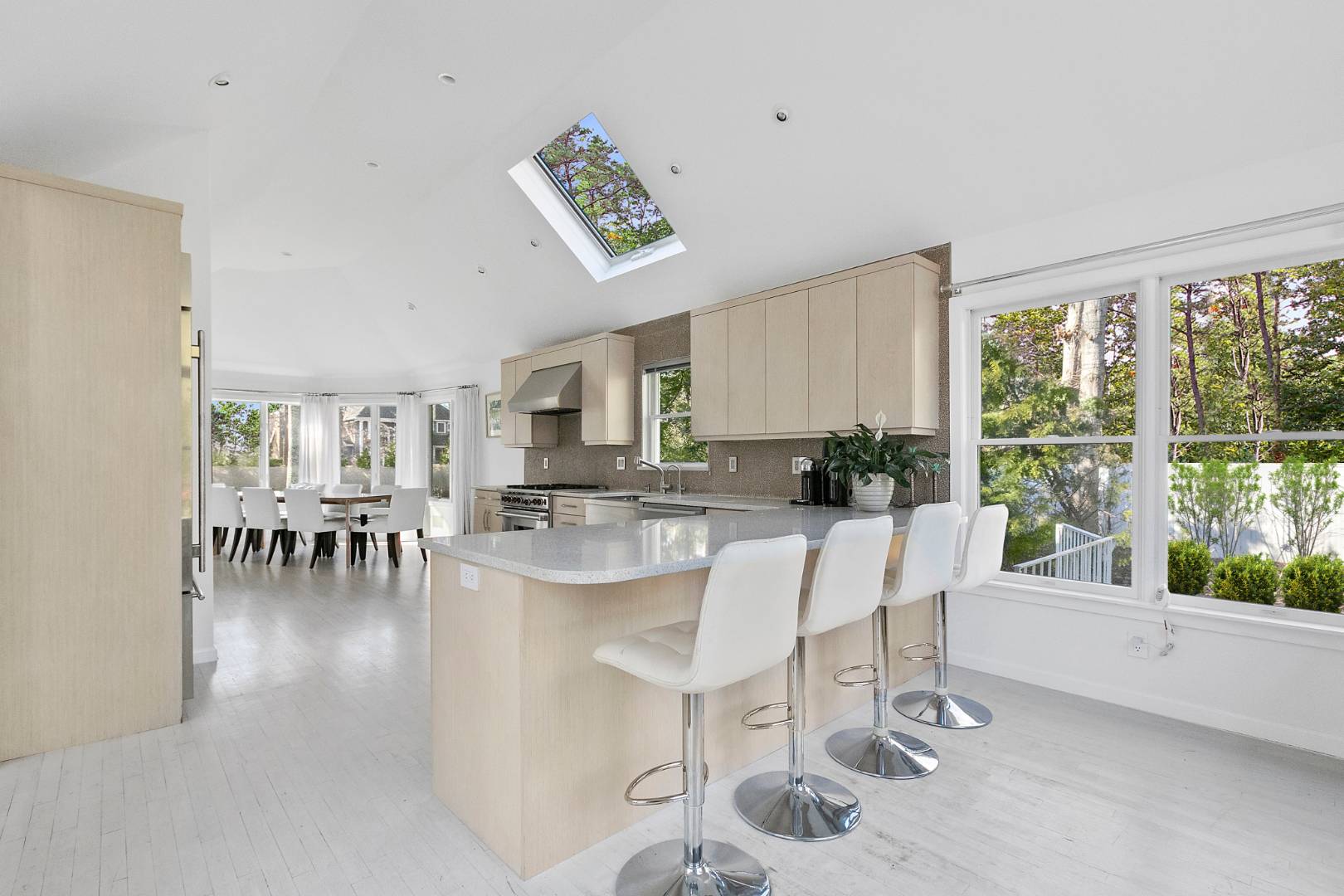 47 Tansey Lane Bridgehampton, NY 11932 - Photo 9 of 28 a dining room with furniture and a large window
