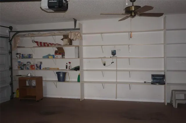 a kitchen with a refrigerator and cabinets