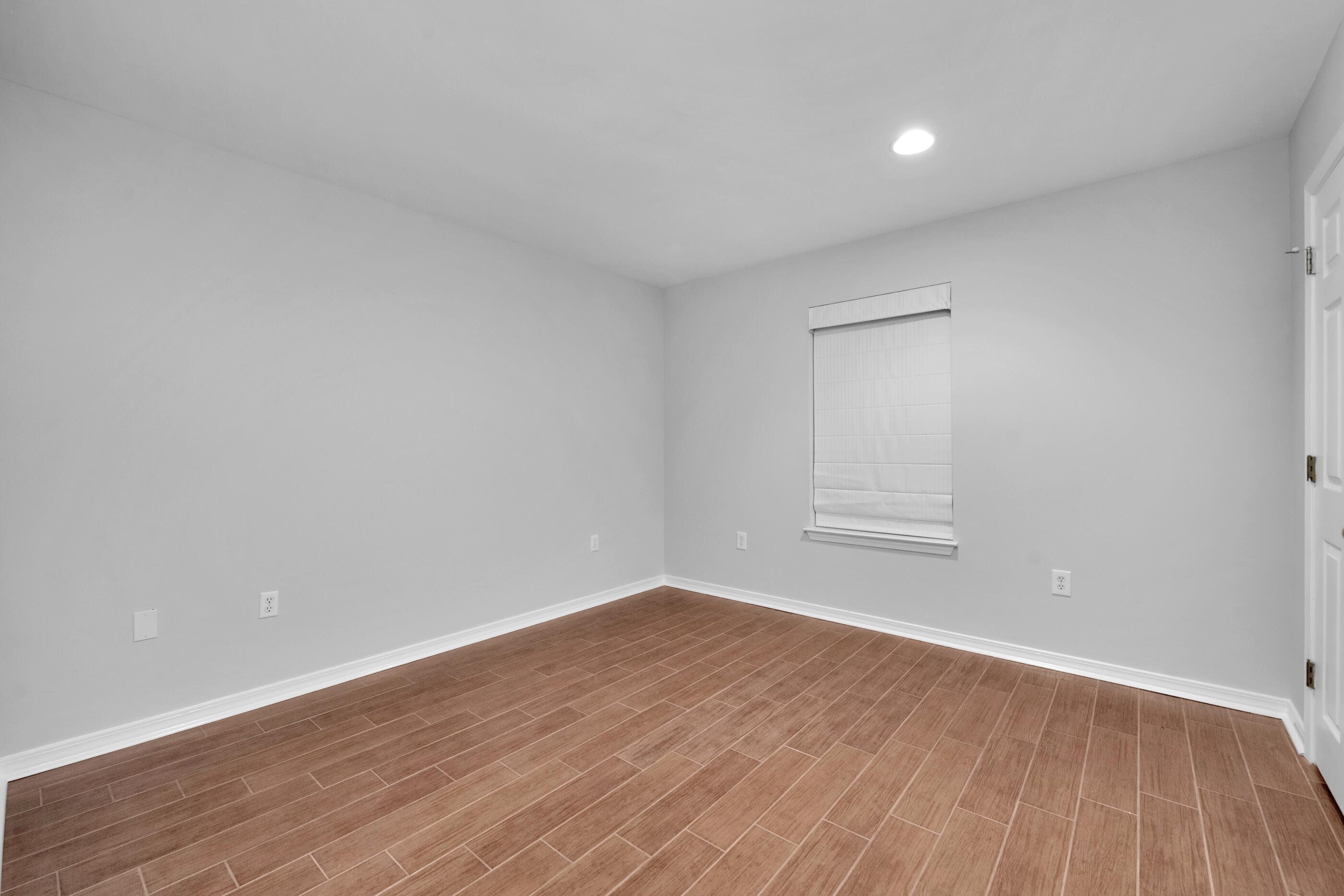 44 Beacon Way Santa Rosa Beach, FL 32459 - Photo 14 of 29 a view of empty room with wooden floor and fan