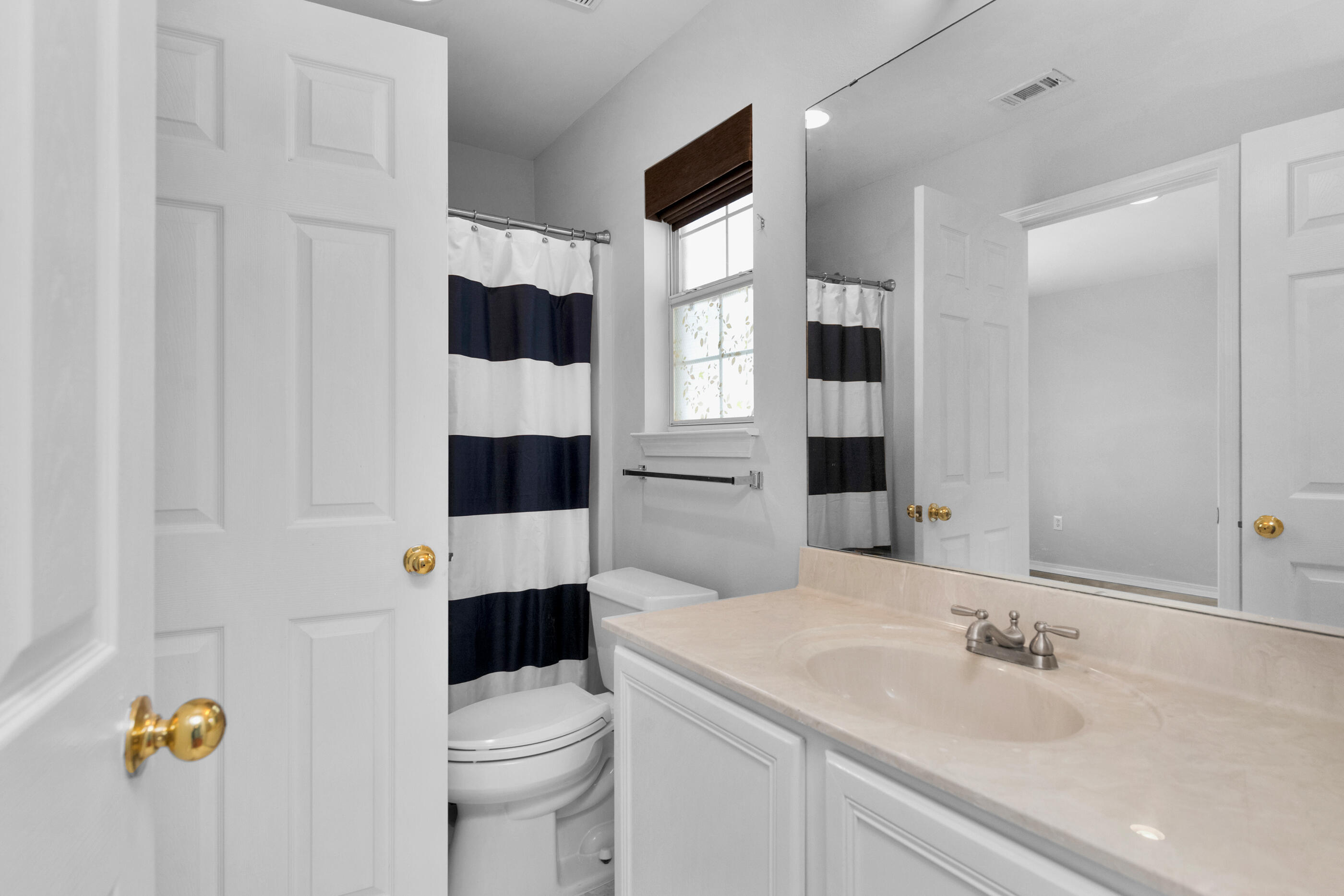 44 Beacon Way Santa Rosa Beach, FL 32459 - Photo 18 of 29 a bathroom with a sink and a mirror