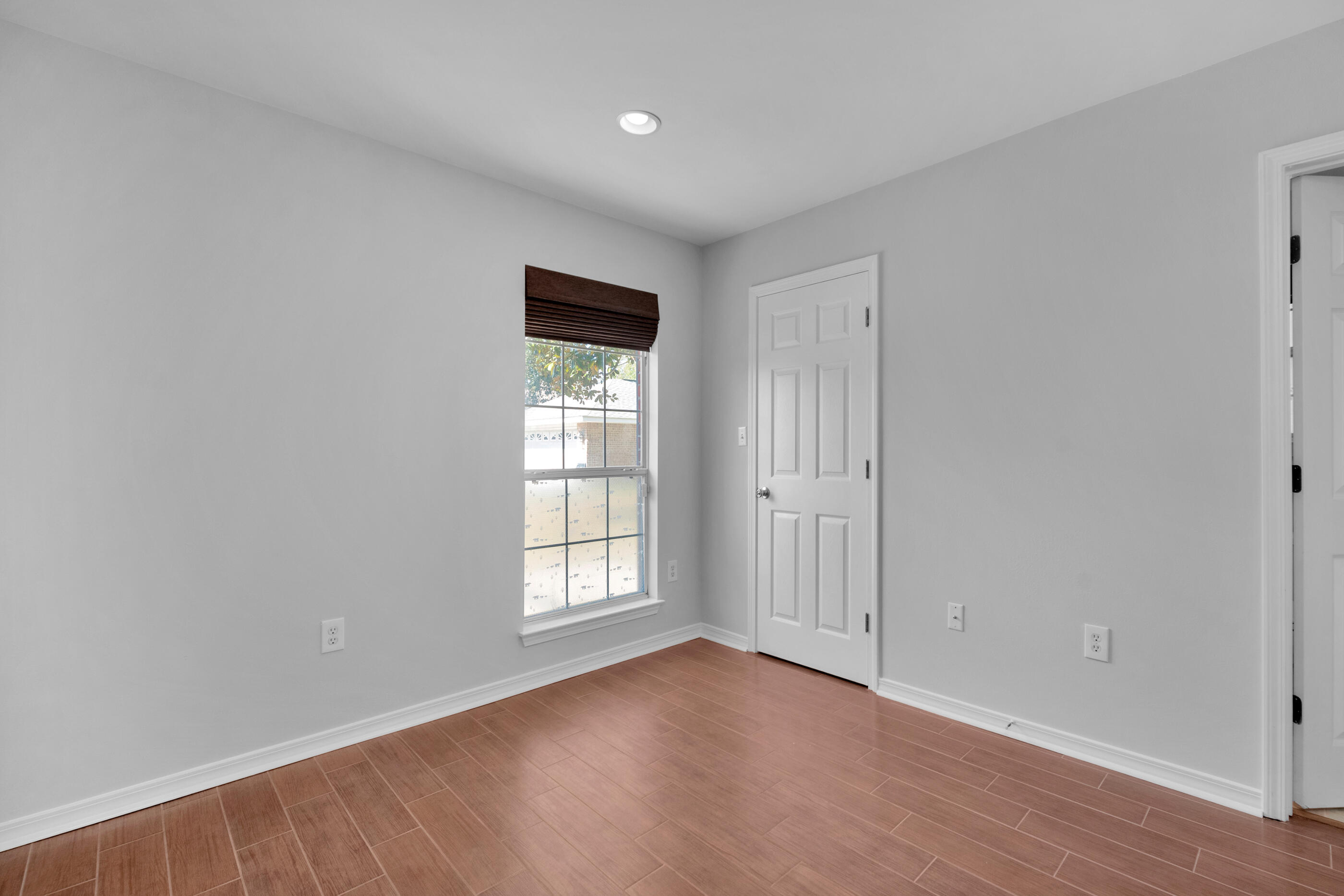 44 Beacon Way Santa Rosa Beach, FL 32459 - Photo 20 of 29 an empty room with wooden floor and windows