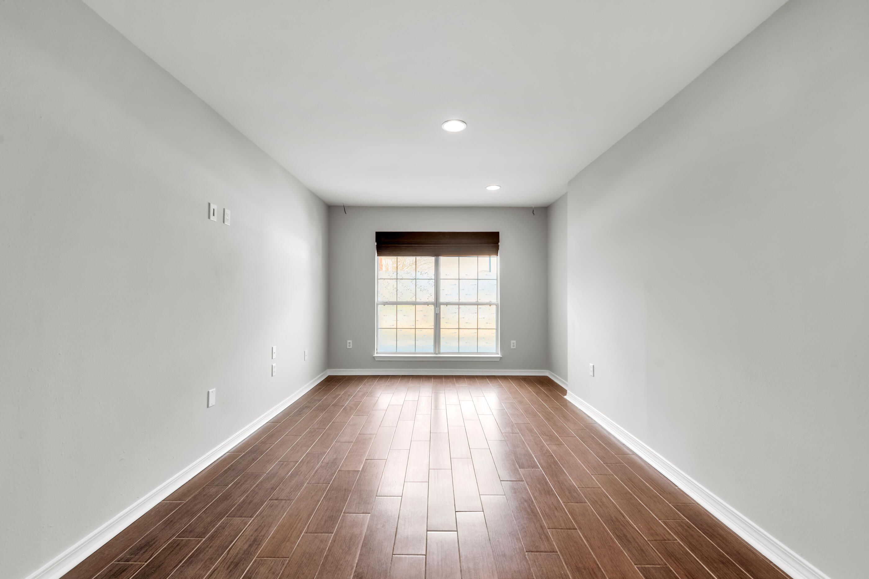 44 Beacon Way Santa Rosa Beach, FL 32459 - Photo 8 of 29 an empty room with wooden floor and windows