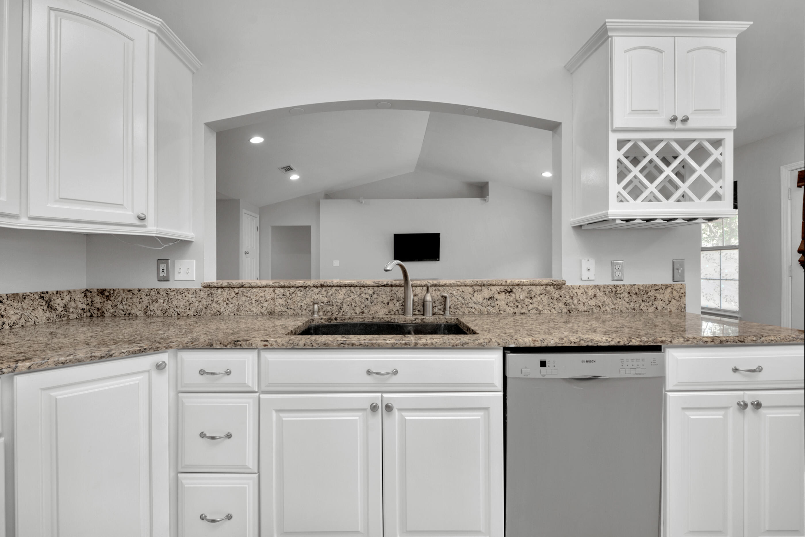44 Beacon Way Santa Rosa Beach, FL 32459 - Photo 10 of 29 a kitchen with granite countertop a sink and cabinets