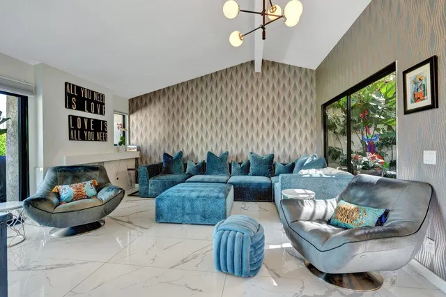 a kitchen with stainless steel appliances a stove a sink and a refrigerator