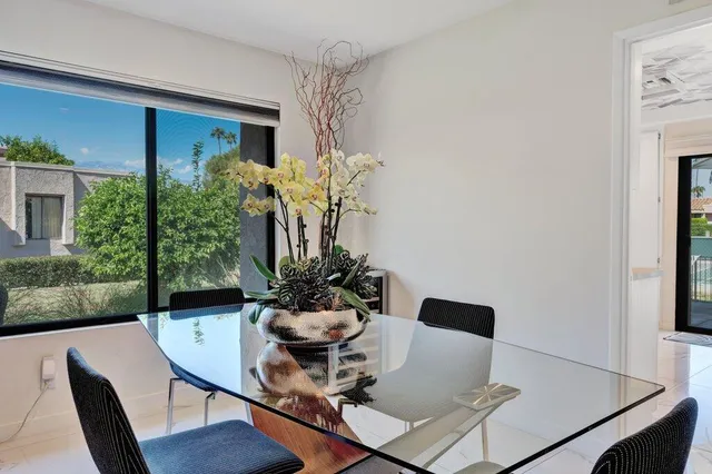 a view of a backyard with a patio and lake view