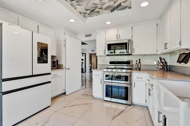 a bathroom with a sink a mirror and a toilet