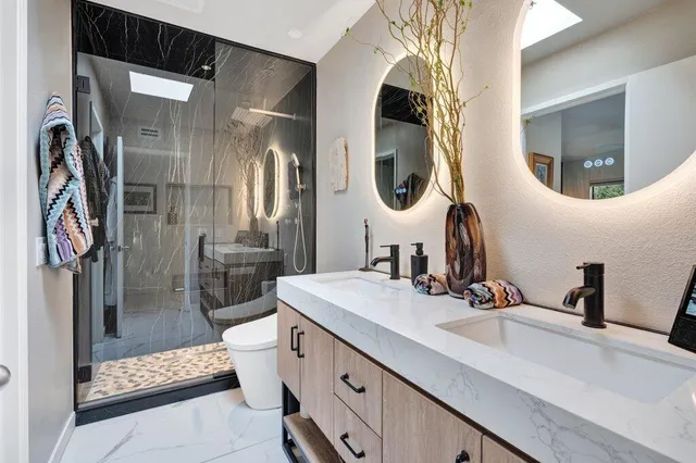 a view of a house with a yard and potted plants