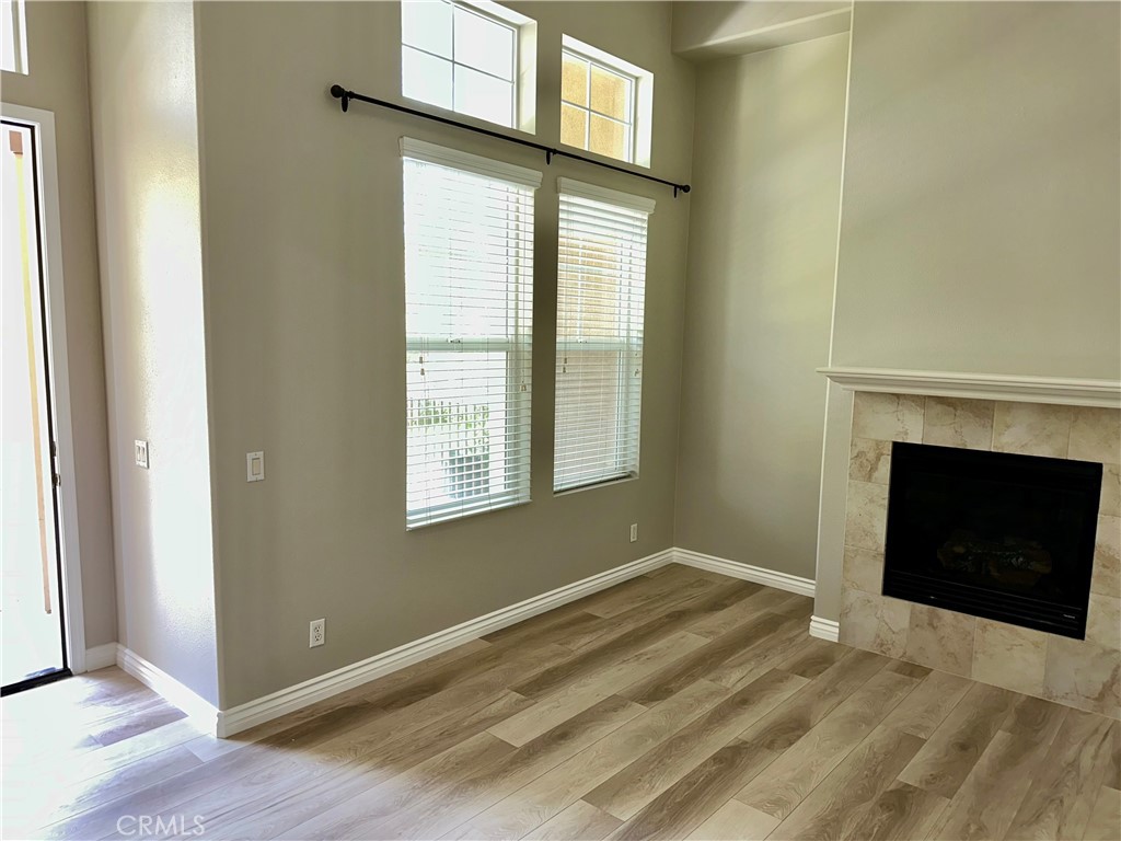 21 Durlston Way Ladera Ranch, CA 92694 - Photo 6 of 47 a view of an empty room with wooden floor and a window