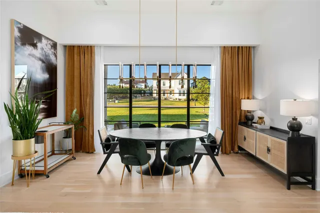 a view of a dining room with furniture and window