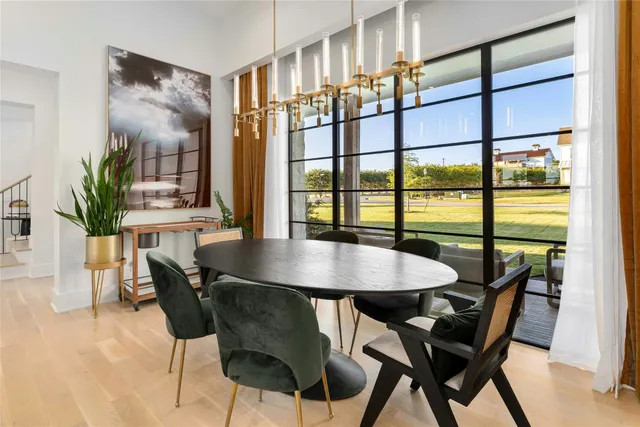 a bedroom with a bed a flat screen tv and a couch