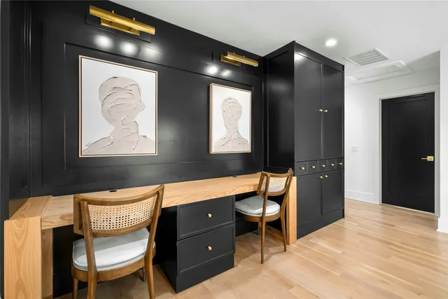 a bedroom with a large bed and a large window