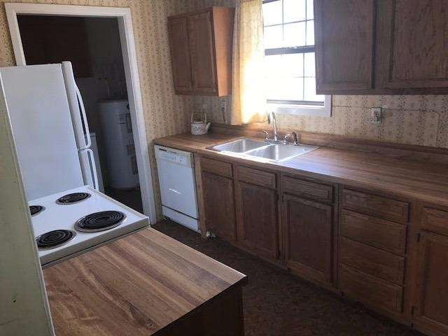 641 State Highway Ralls, TX 79357 - Photo 4 of 7 a kitchen with sink cabinets and window