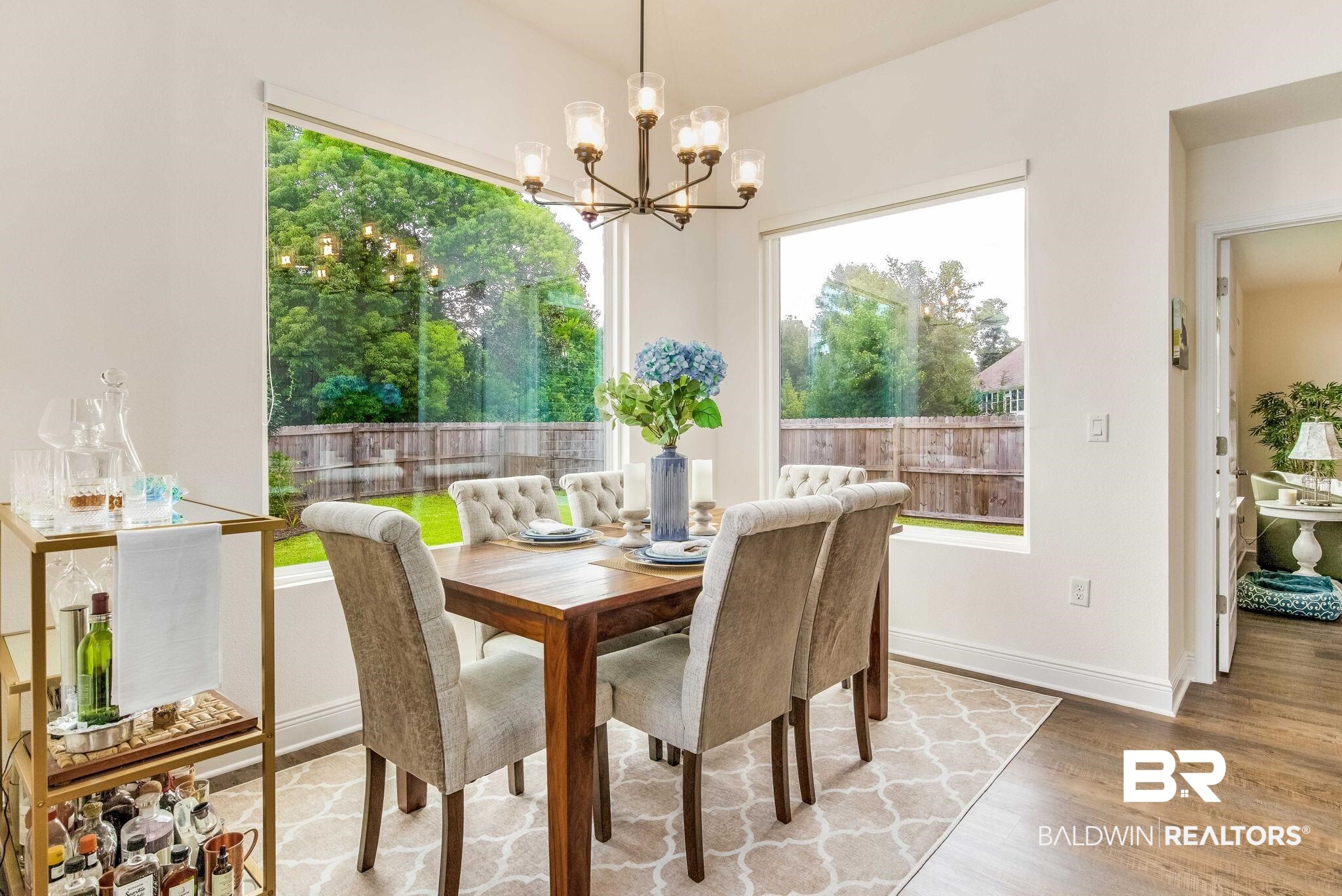 2222 Club House Drive Lillian, AL 36549 - Photo 7 of 49 Dining area featuring light wood finished floors and a chandelier