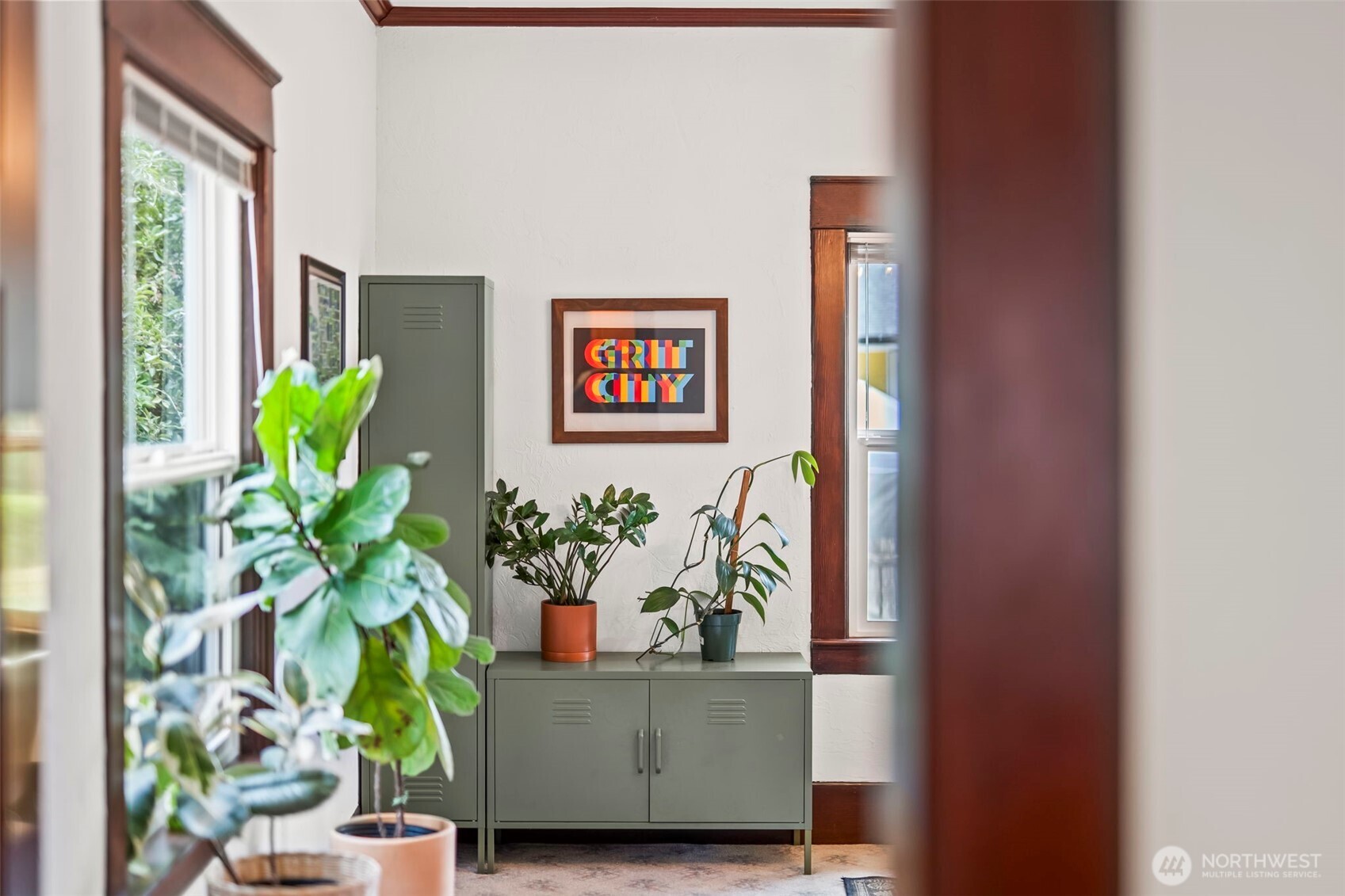 363 Del Monte Avenue Fircrest, WA 98466 - Photo 13 of 39 a vase with flowers sitting on a table with a window