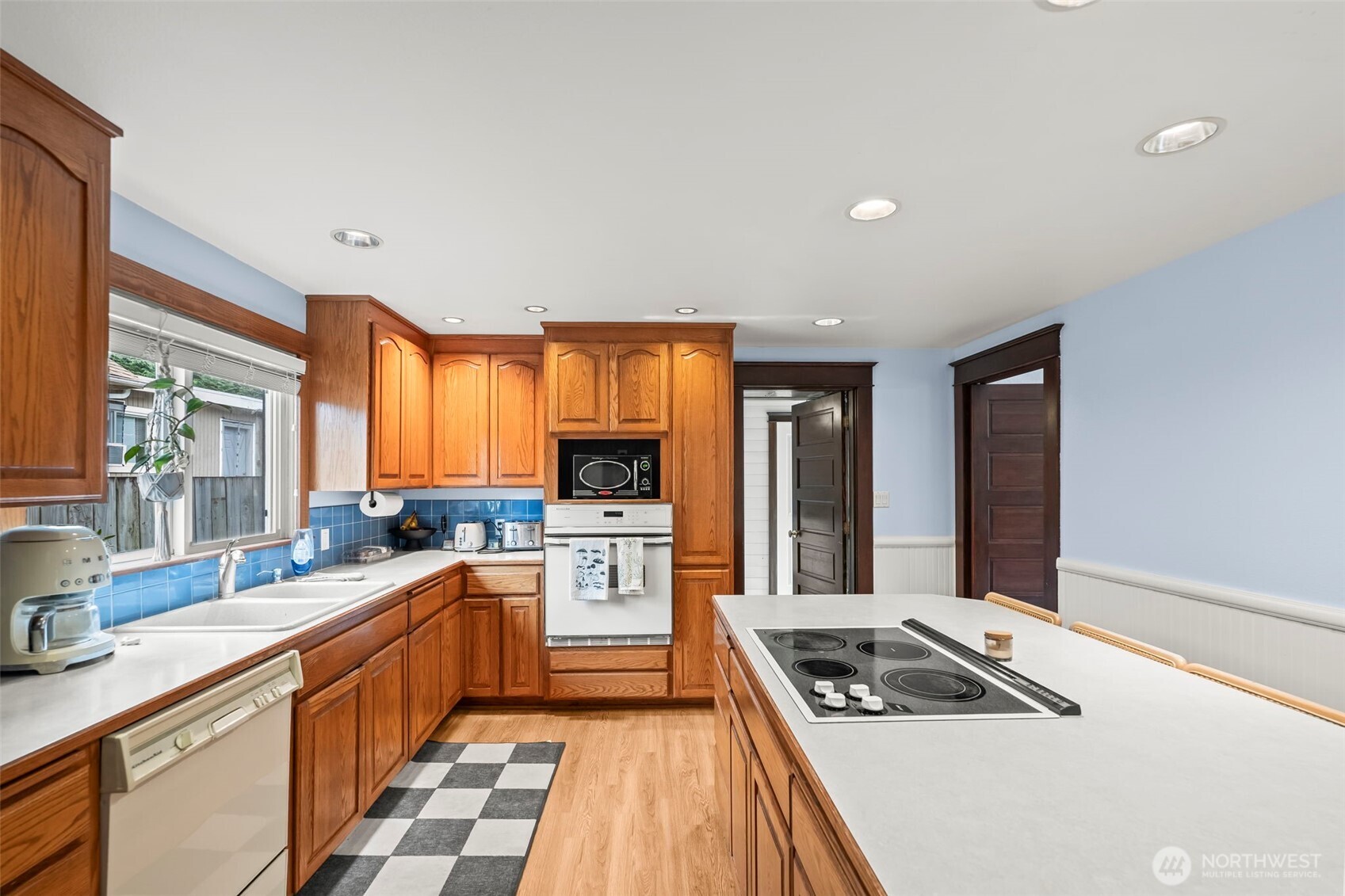 363 Del Monte Avenue Fircrest, WA 98466 - Photo 15 of 39 a kitchen with a sink stove and cabinets