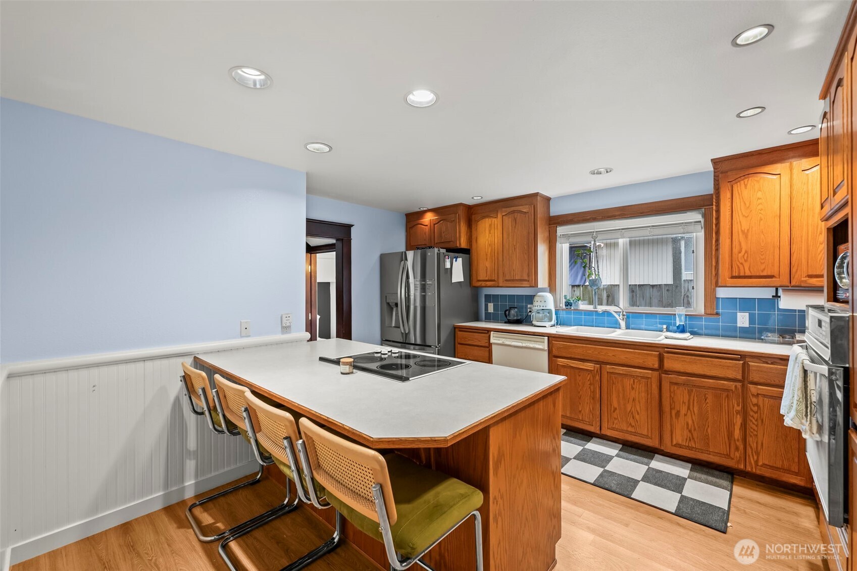 363 Del Monte Avenue Fircrest, WA 98466 - Photo 16 of 39 a kitchen that has a table and chairs in it