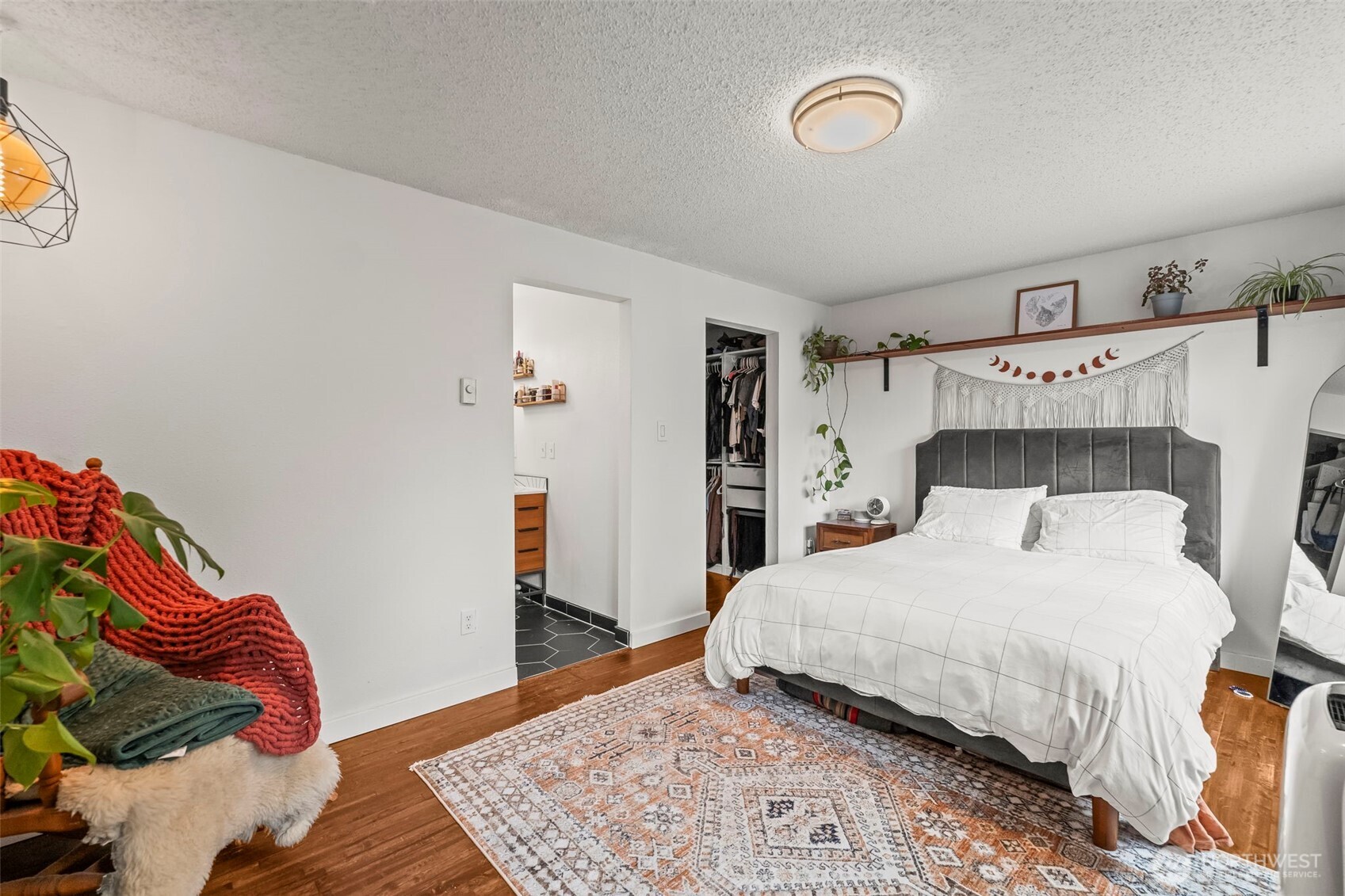 363 Del Monte Avenue Fircrest, WA 98466 - Photo 17 of 39 a bedroom with a bed and a painting on the wall