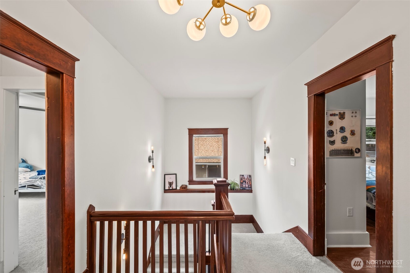 363 Del Monte Avenue Fircrest, WA 98466 - Photo 24 of 39 a view of a hallway to a livingroom with wooden floor and furniture