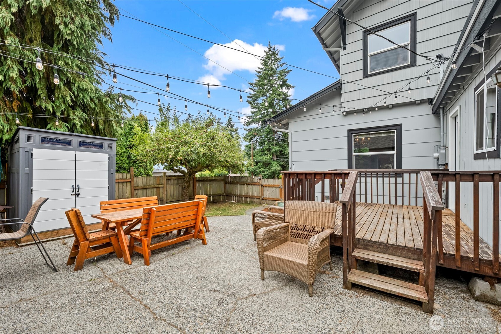 363 Del Monte Avenue Fircrest, WA 98466 - Photo 33 of 39 a backyard of a house with wooden fence and outdoor seating