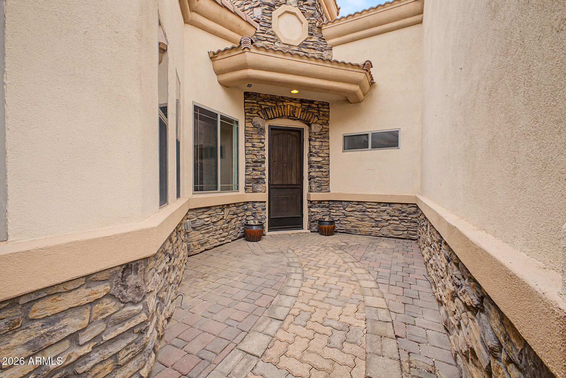 6202 East McKellips Road, Unit 19 Mesa, AZ 85215 - Photo 3 of 37 a view of a hallway with wooden floor and a rug