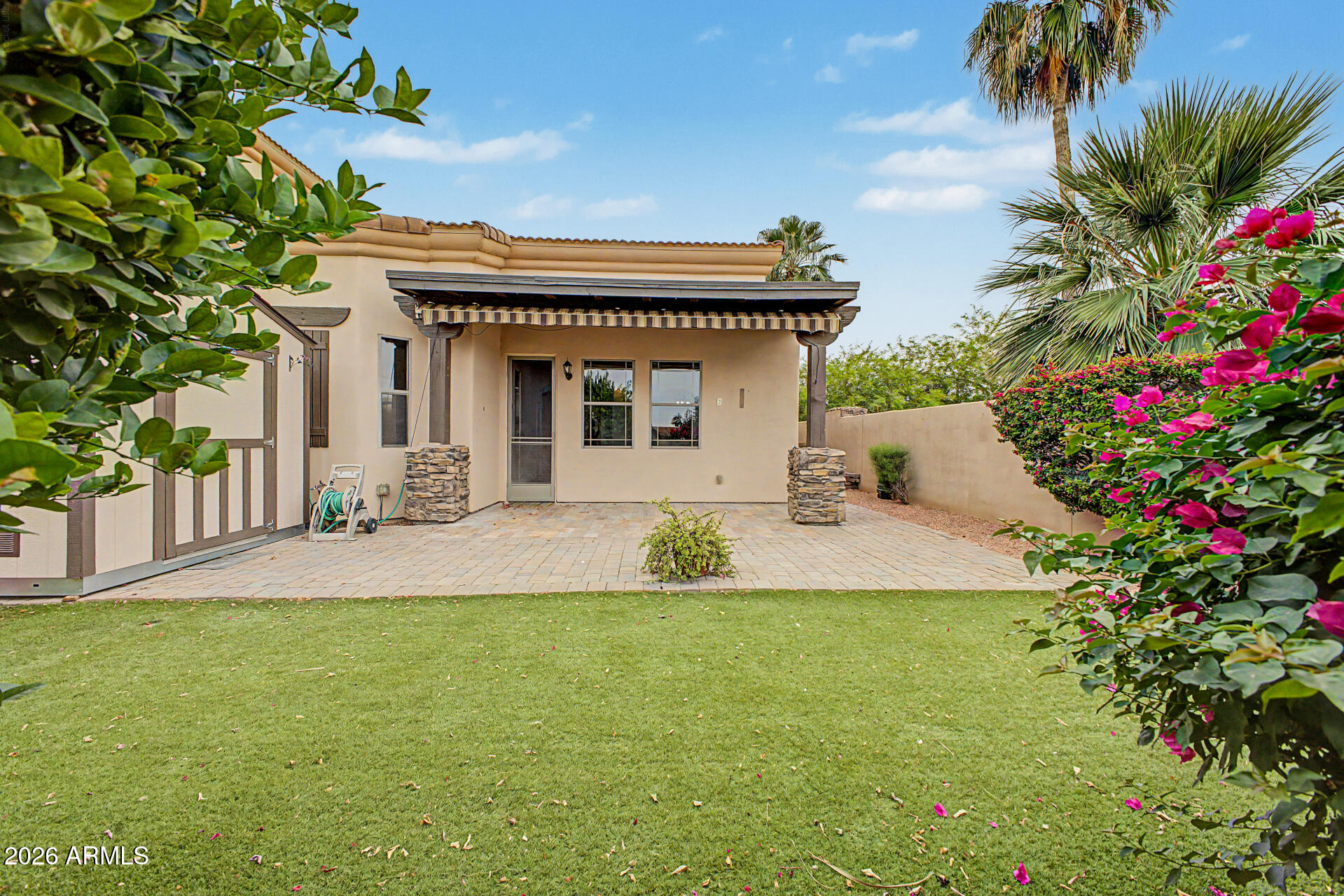 6202 East McKellips Road, Unit 19 Mesa, AZ 85215 - Photo 36 of 37 a view of a house with a yard