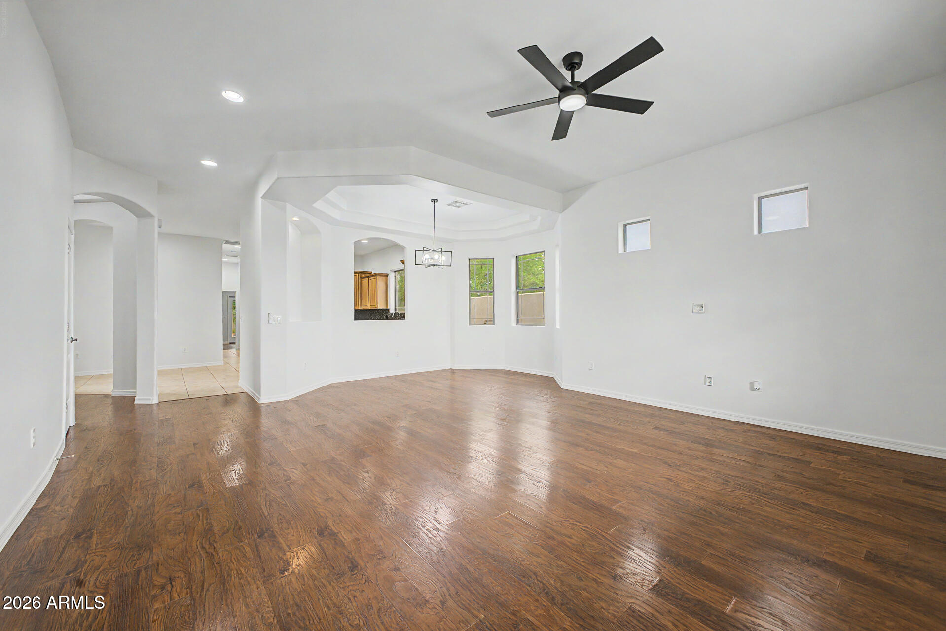 6202 East McKellips Road, Unit 19 Mesa, AZ 85215 - Photo 6 of 37 wooden floor in an empty room with a window