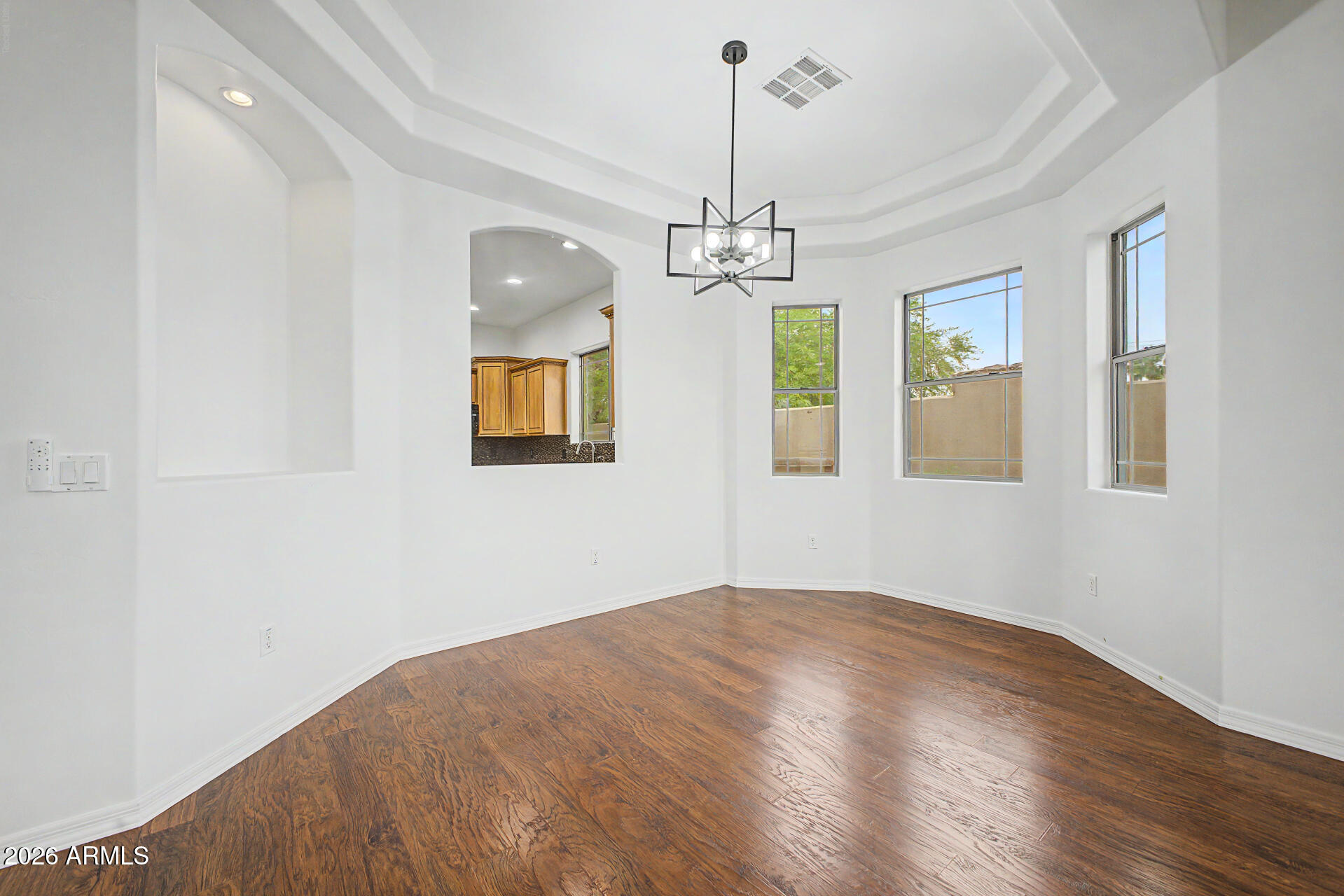 6202 East McKellips Road, Unit 19 Mesa, AZ 85215 - Photo 8 of 37 a view of empty room with wooden floor
