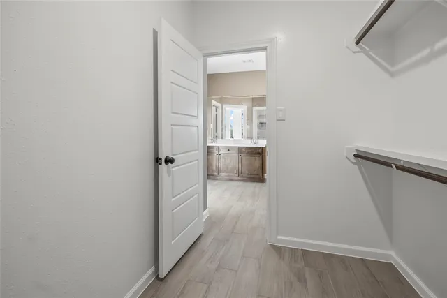 a view of a kitchen from the hallway