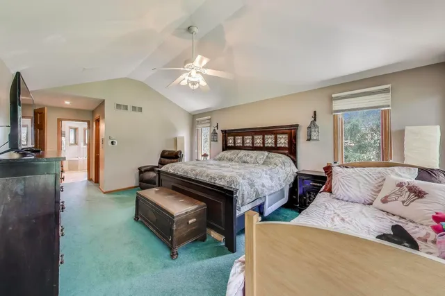 a bathroom with a tub a sink and a shower