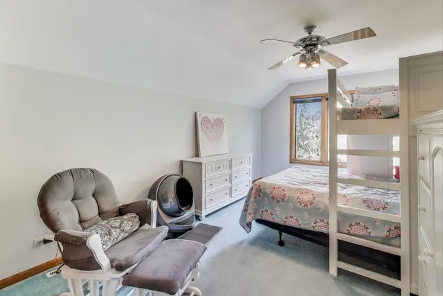 a spacious bathroom with a granite countertop sink toilet and shower