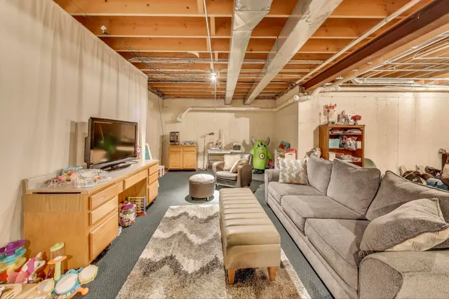 a view of swimming pool with outdoor seating and plants