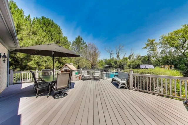 a view of swimming pool with chairs