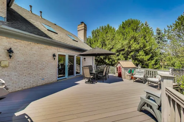 a swimming pool with an outdoor space and seating area