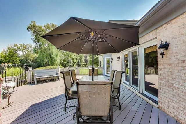 a house with swimming pool in front of it