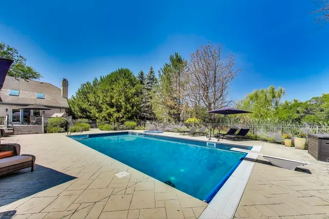 a view of a yard with a house in the background