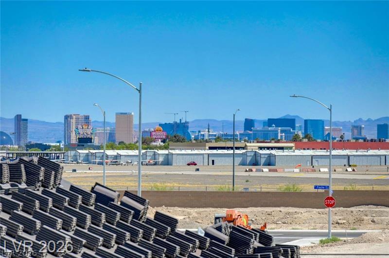 3318 North Decatur Boulevard, Unit 2152 Las Vegas, NV 89130 - Photo 50 of 58 A panoramic vista reveals urban skyline against distant mountains, adjacent to an active airfield.