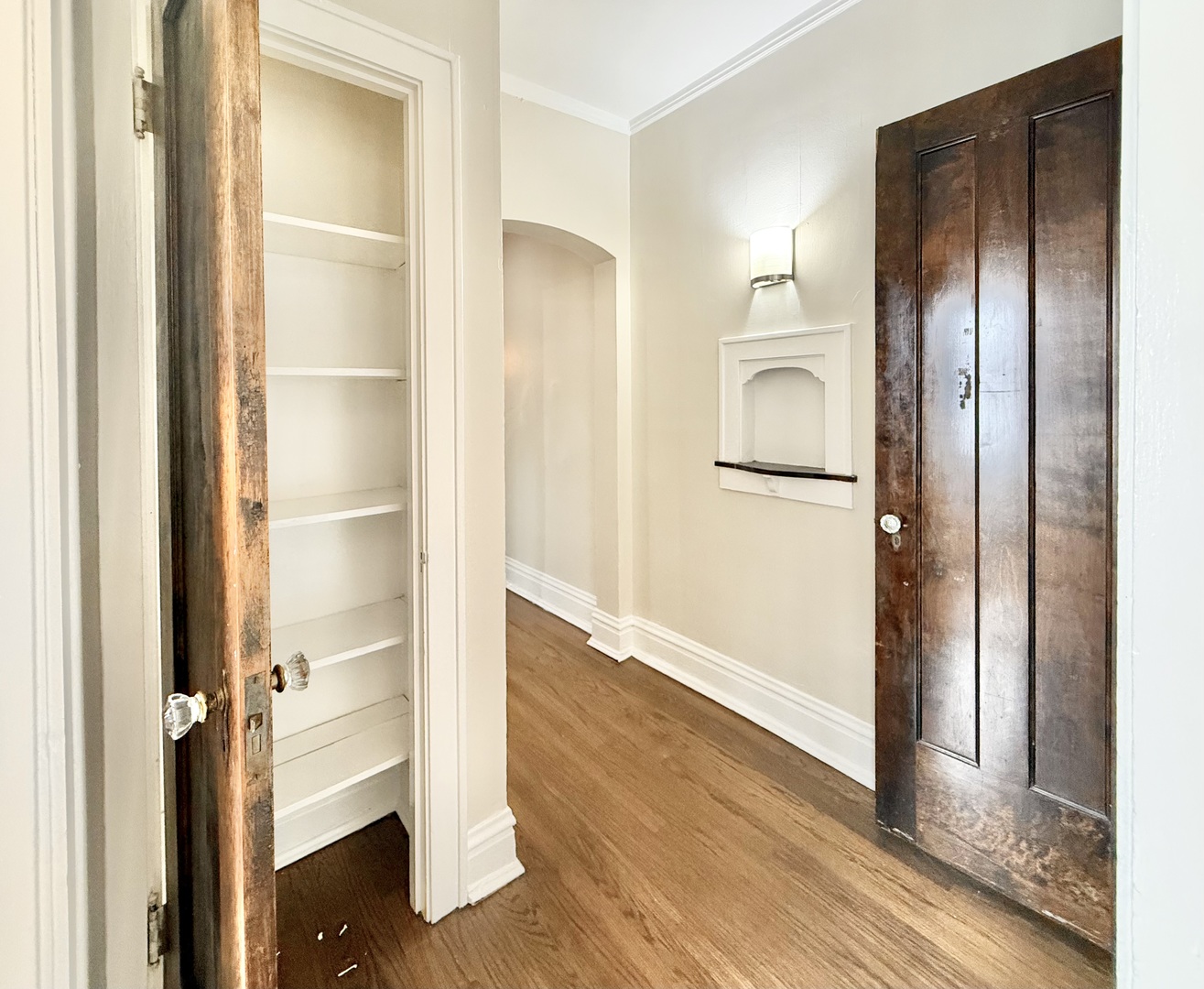 314 North Maple Avenue, Unit 3S Oak Park, IL 60302 - Photo 12 of 22 a view of a walk in closet and bedroom with wooden floor