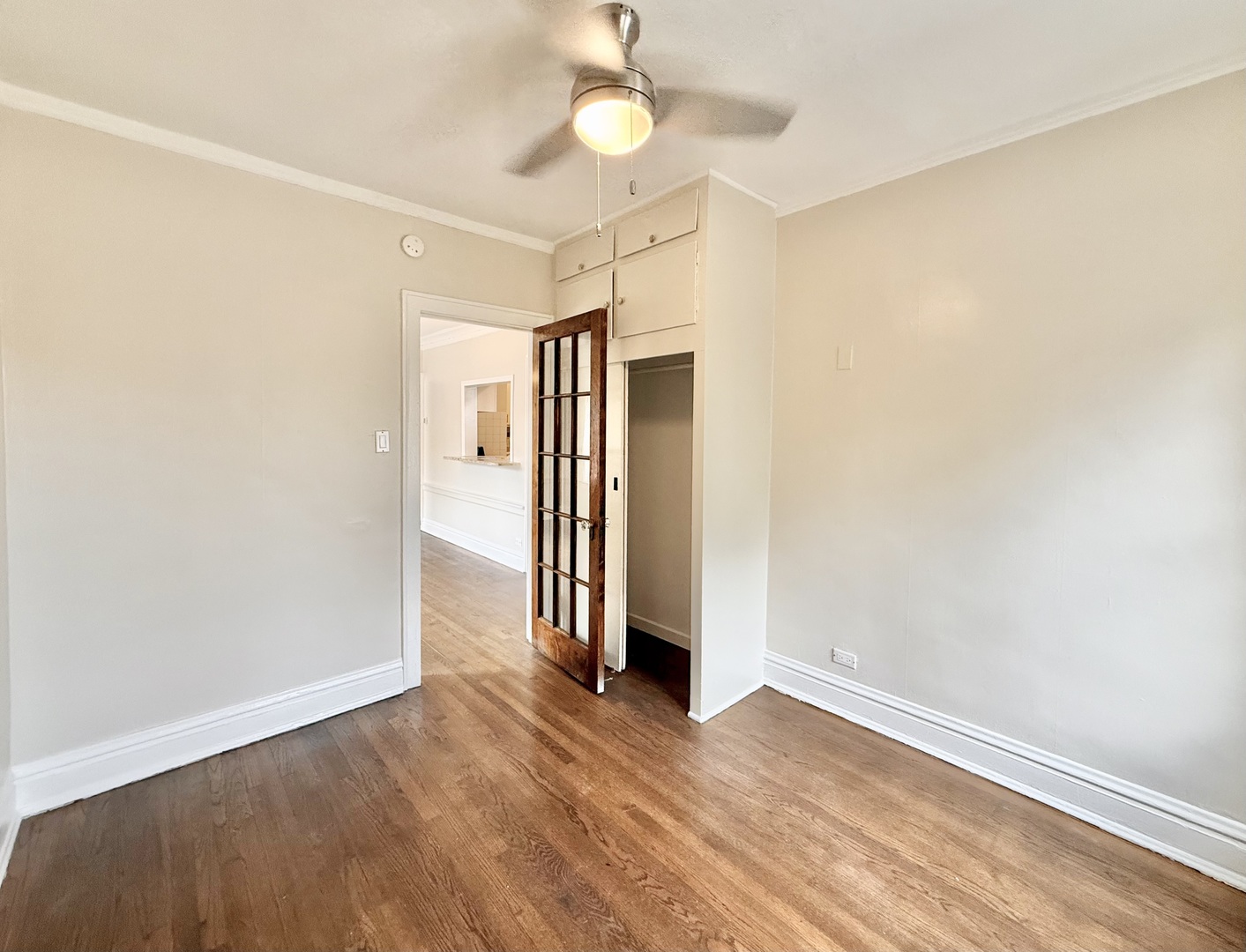 314 North Maple Avenue, Unit 3S Oak Park, IL 60302 - Photo 17 of 22 an empty room with wooden floor and windows