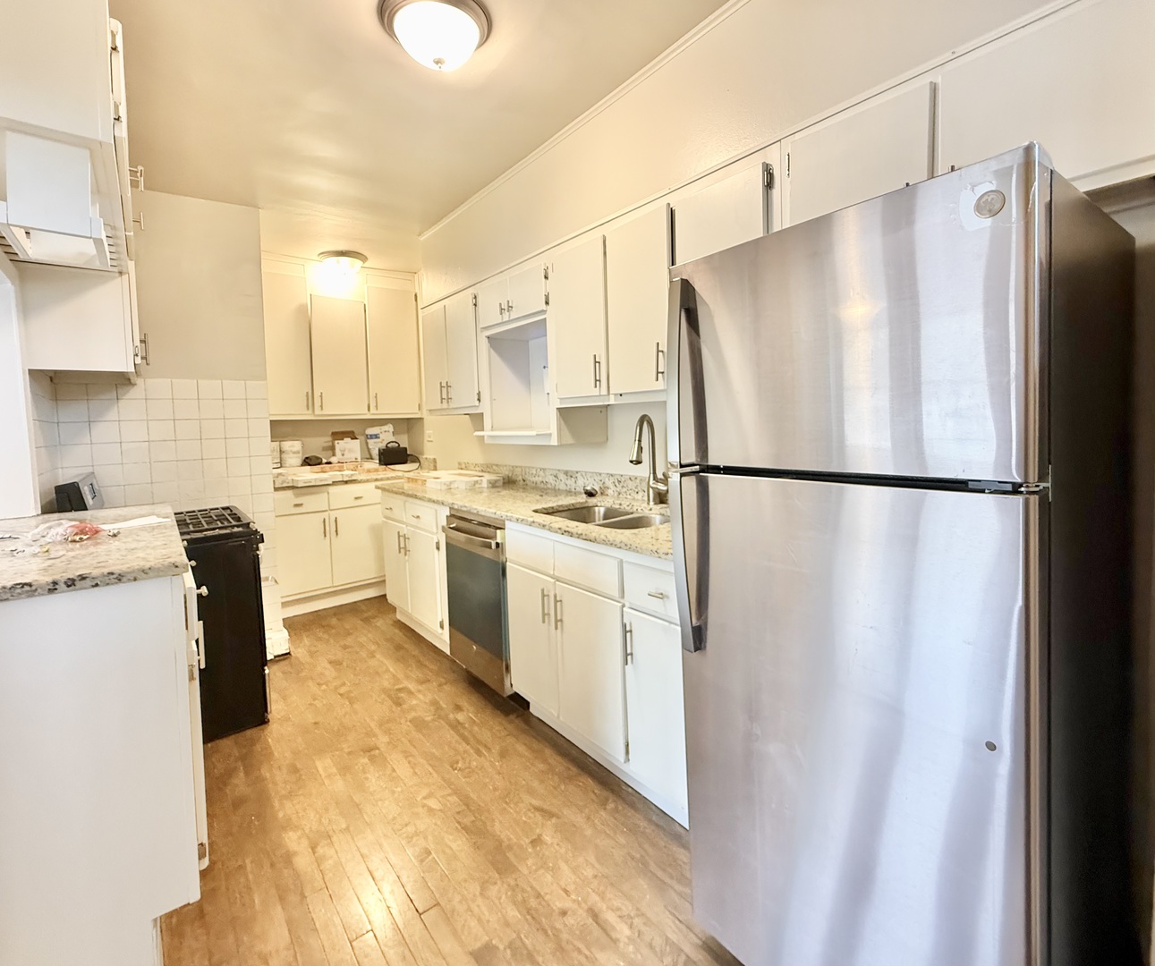 314 North Maple Avenue, Unit 3S Oak Park, IL 60302 - Photo 18 of 22 a kitchen with white cabinets and white appliances