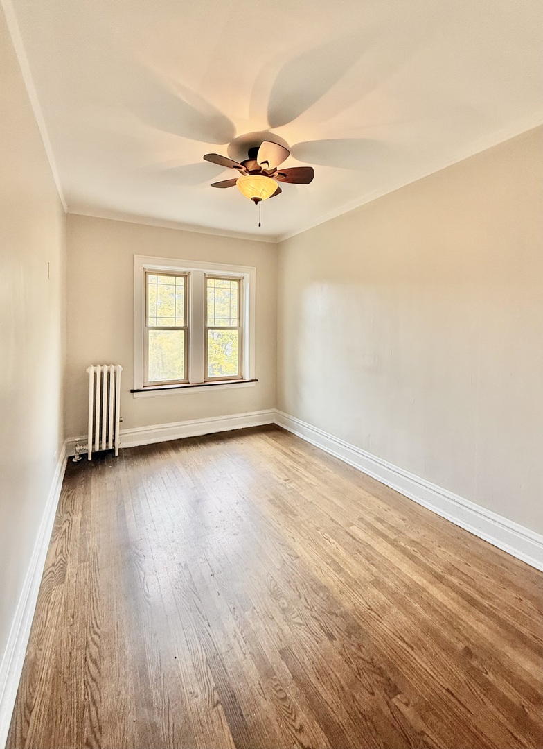 314 North Maple Avenue, Unit 3S Oak Park, IL 60302 - Photo 5 of 22 wooden floor in an empty room with a window