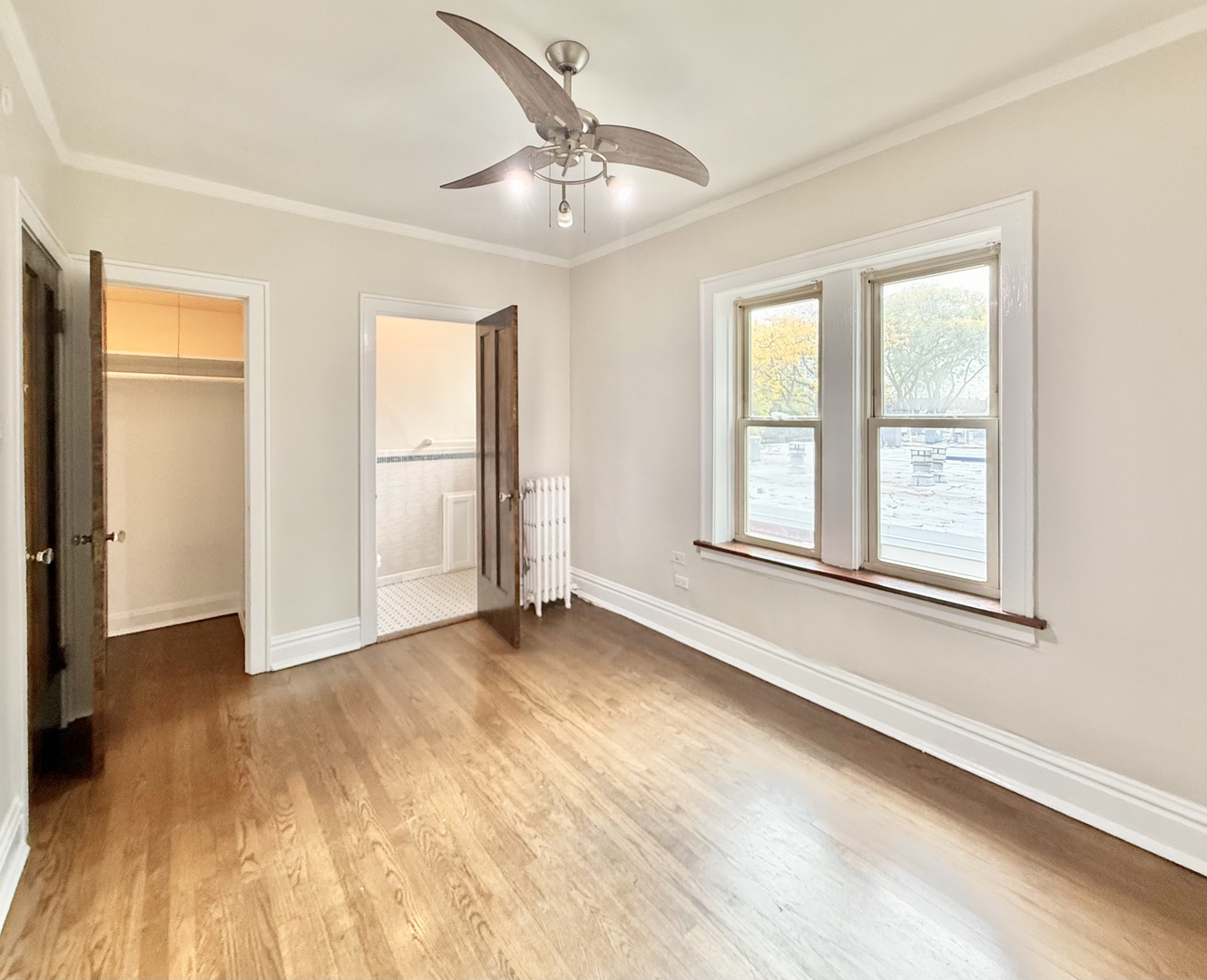 314 North Maple Avenue, Unit 3S Oak Park, IL 60302 - Photo 9 of 22 a view of an empty room with a window and wooden floor