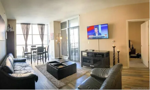a living room with furniture and a flat screen tv
