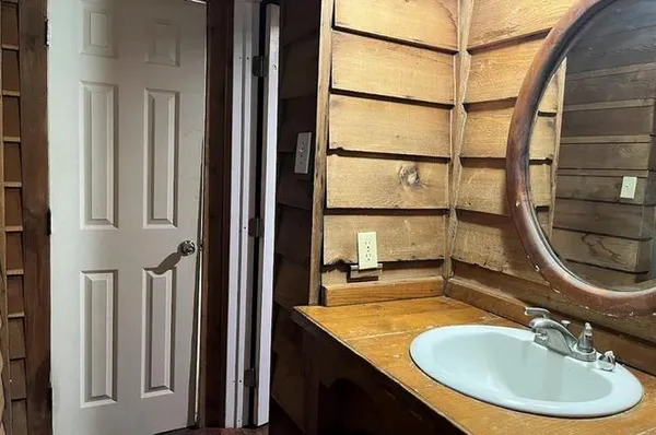 a bathroom with a sink and a mirror