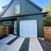 a front view of a house with a garage