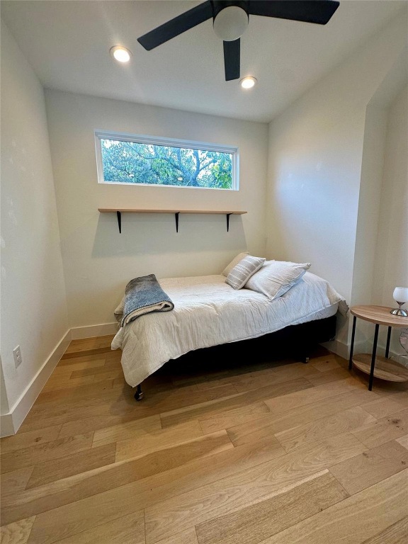 3417 Elija Street, Unit 2 Austin, TX 78745 - Photo 17 of 28 Bedroom featuring light wood-type flooring, a ceiling fan, and recessed lighting