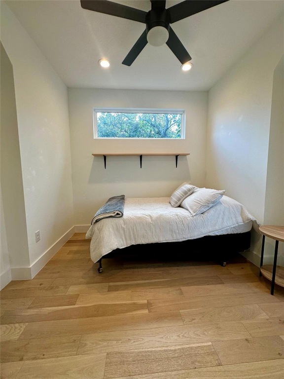 3417 Elija Street, Unit 2 Austin, TX 78745 - Photo 18 of 28 Bedroom with light wood-style flooring, ceiling fan, and recessed lighting