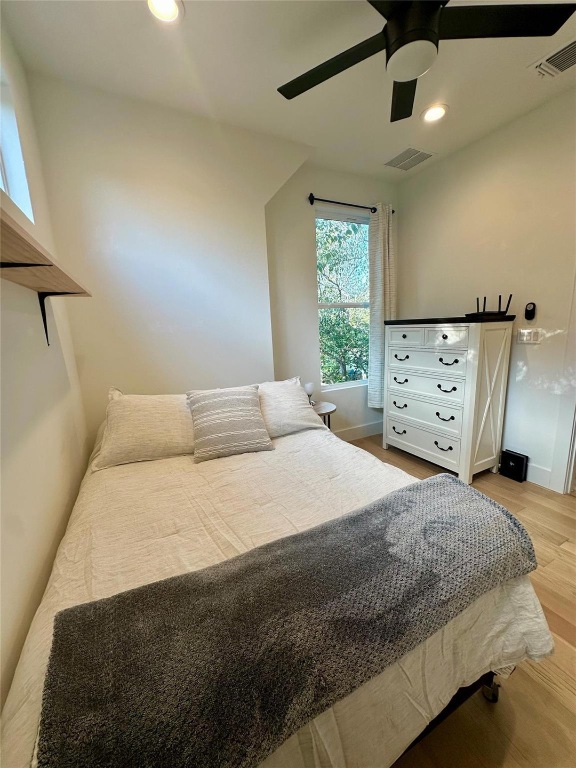 3417 Elija Street, Unit 2 Austin, TX 78745 - Photo 23 of 28 Bedroom featuring light wood-style floors, a ceiling fan, and recessed lighting