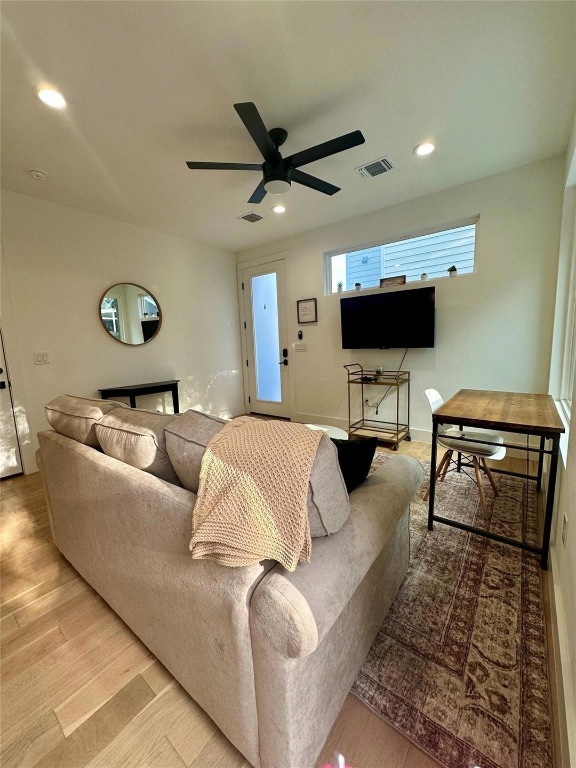 3417 Elija Street, Unit 2 Austin, TX 78745 - Photo 26 of 28 Living area featuring wood finished floors, recessed lighting, and ceiling fan